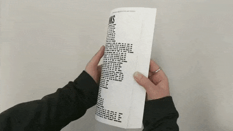 A book is flipped through one way with text and the other way with pictures